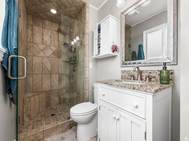 523 Mountain View Road Centerville, UT 84014 - Photo 12 of 33 Full bathroom with vanity, a shower stall, and ornamental molding