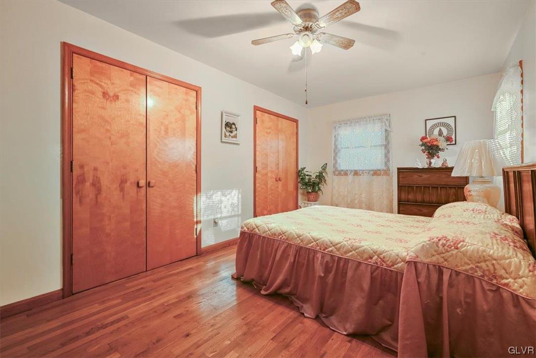 300 Turkey Ridge Kunkletown, PA 18058 - Photo 8 of 29 a bedroom with a large bed and a chandelier