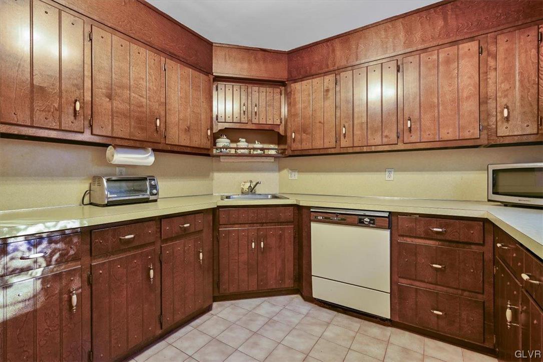300 Turkey Ridge Kunkletown, PA 18058 - Photo 10 of 29 a kitchen with stainless steel appliances granite countertop wooden cabinets a sink and dishwasher