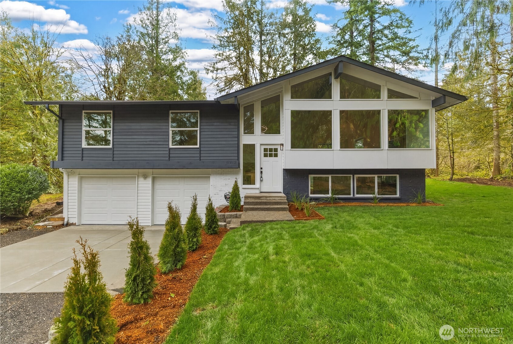 5205 59th Court Southwest Olympia, WA 98512 - Photo 1 of 39 a front view of a house with a yard
