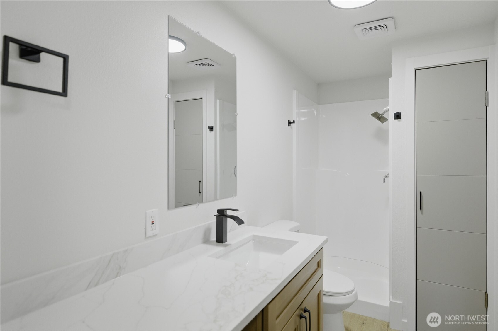 5205 59th Court Southwest Olympia, WA 98512 - Photo 27 of 39 a bathroom with a sink toilet and vanity