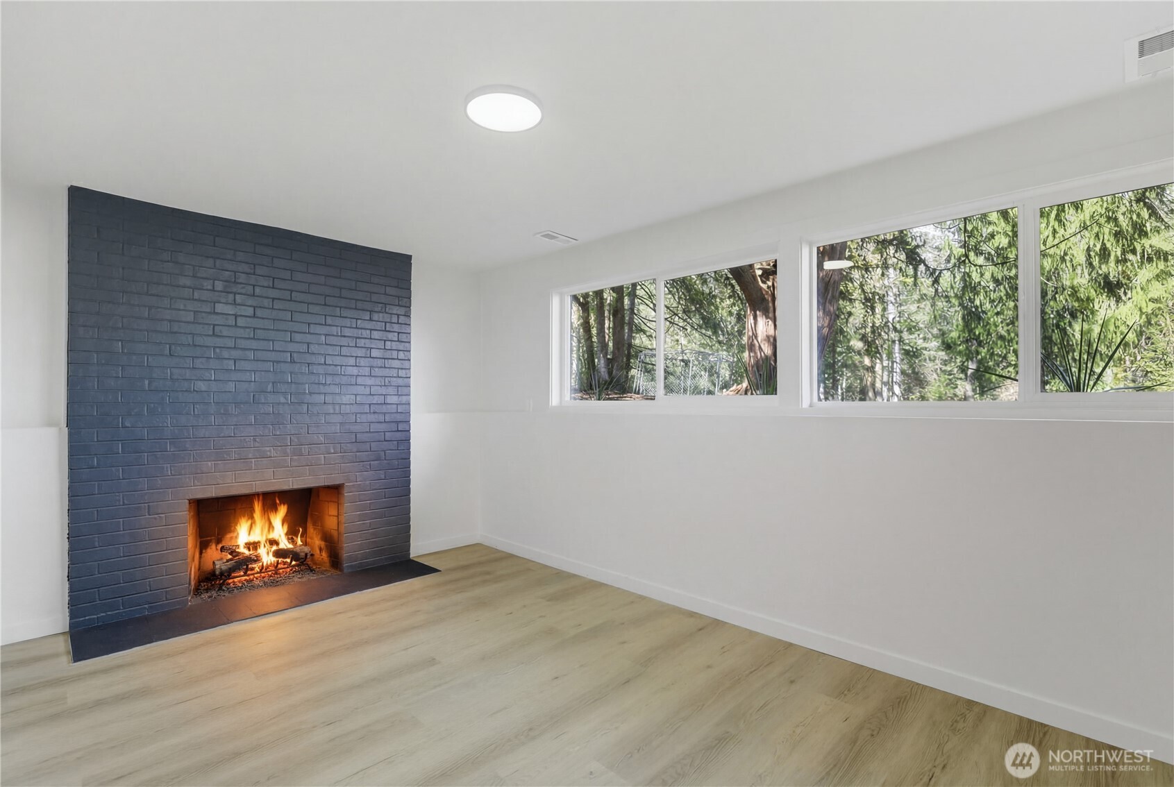 5205 59th Court Southwest Olympia, WA 98512 - Photo 30 of 39 a view of an empty room with a window and fireplace