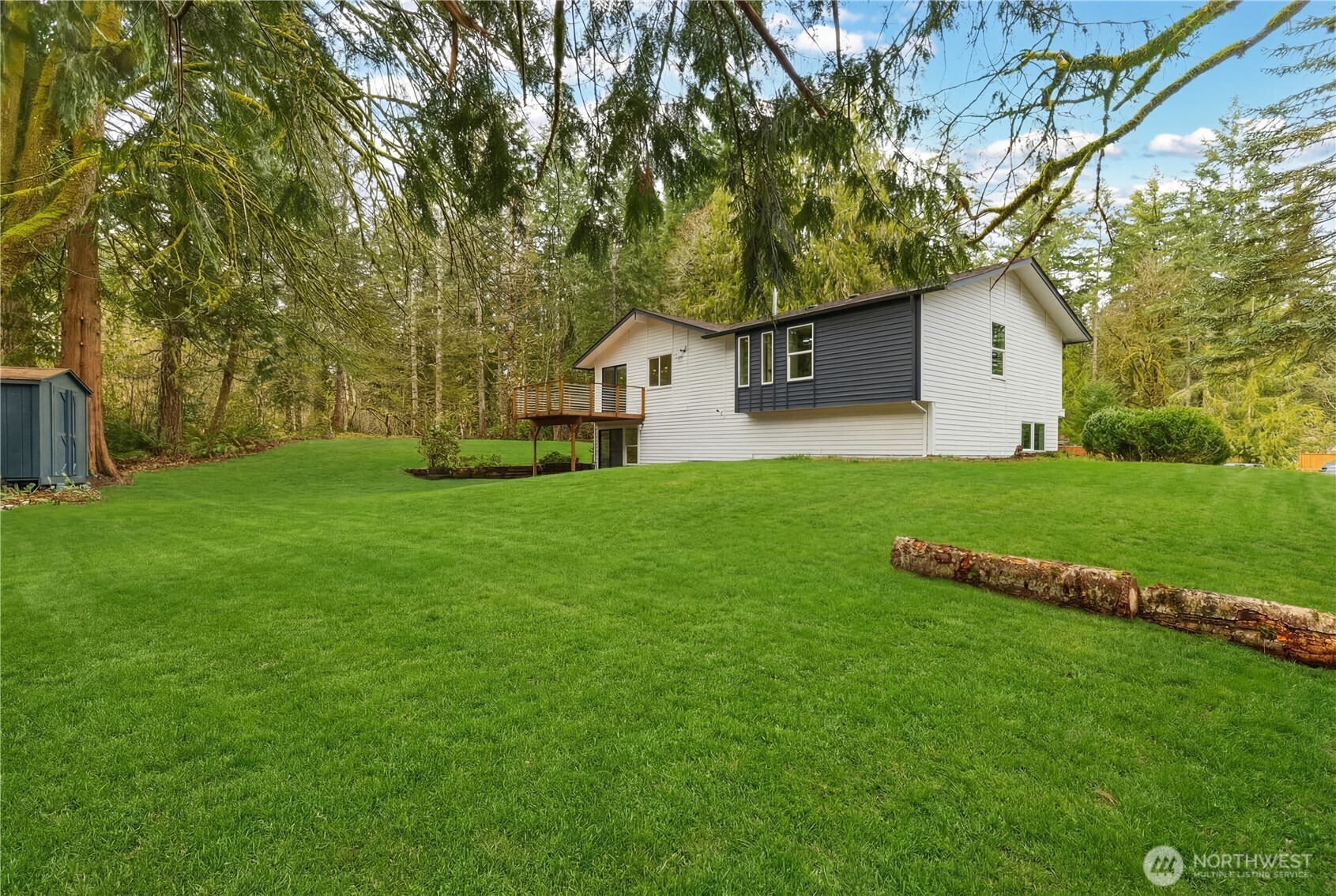 5205 59th Court Southwest Olympia, WA 98512 - Photo 36 of 39 a front view of a house with a yard and trees