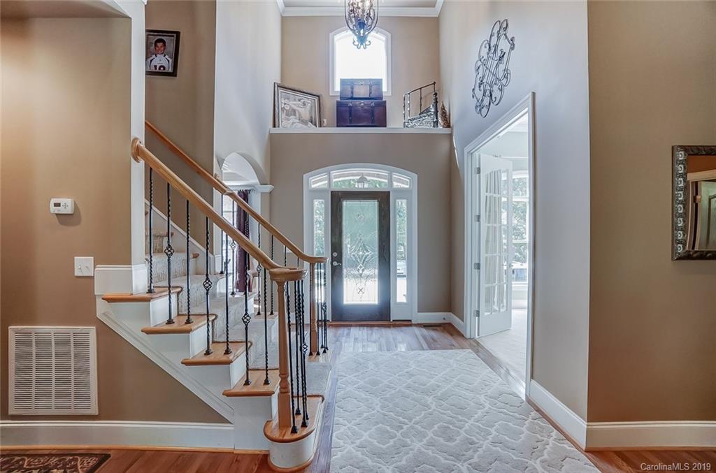 421 Greenbay Road Mooresville, NC 28117 - Photo 3 of 25 a view of entryway and hall with wooden floor