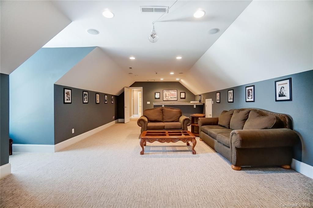421 Greenbay Road Mooresville, NC 28117 - Photo 21 of 25 a living room with furniture and a ceiling fan