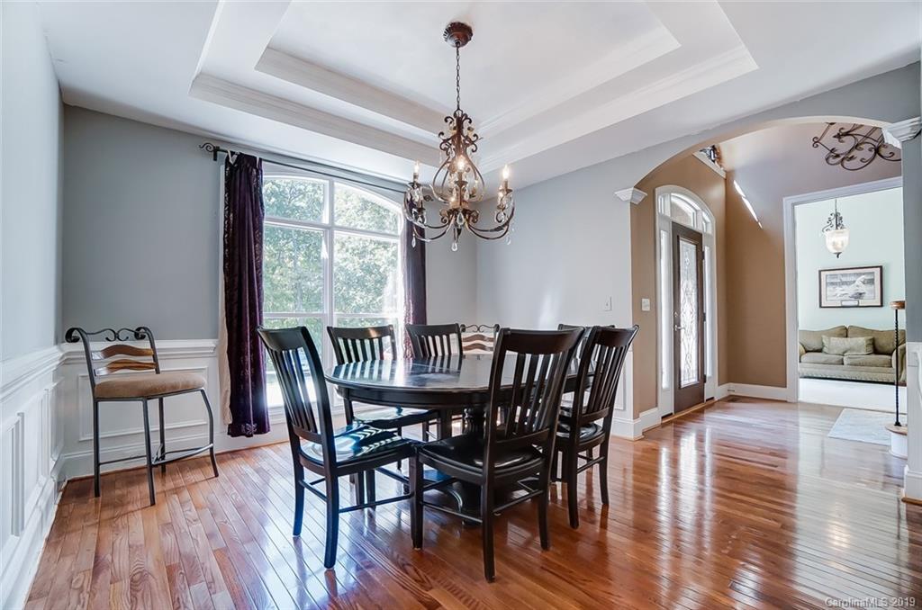421 Greenbay Road Mooresville, NC 28117 - Photo 5 of 25 a view of a dining room with furniture wooden floor and chandelier