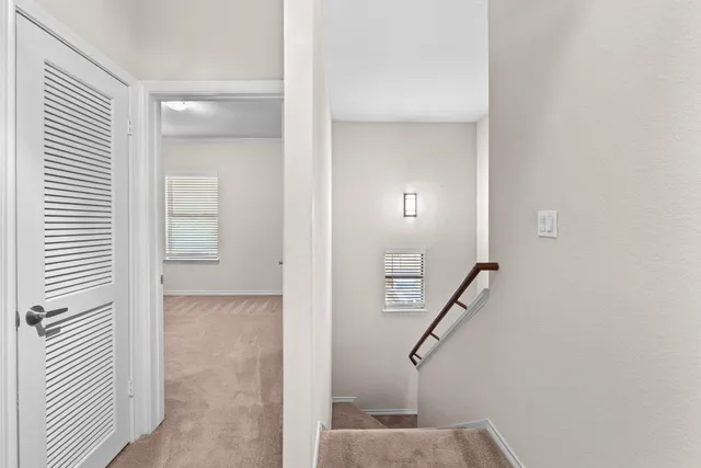 a view of entryway and hall with a hallway