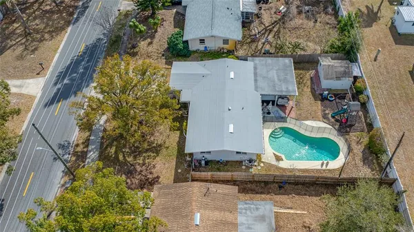 an aerial view of a house with outdoor space