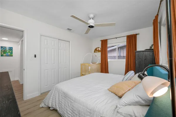 a bedroom with a bed and a dresser