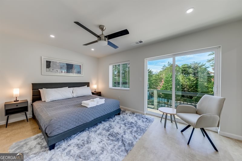 364 Rosen Strasse Helen, GA 30545 - Photo 17 of 45 a bedroom with a large bed and a couch