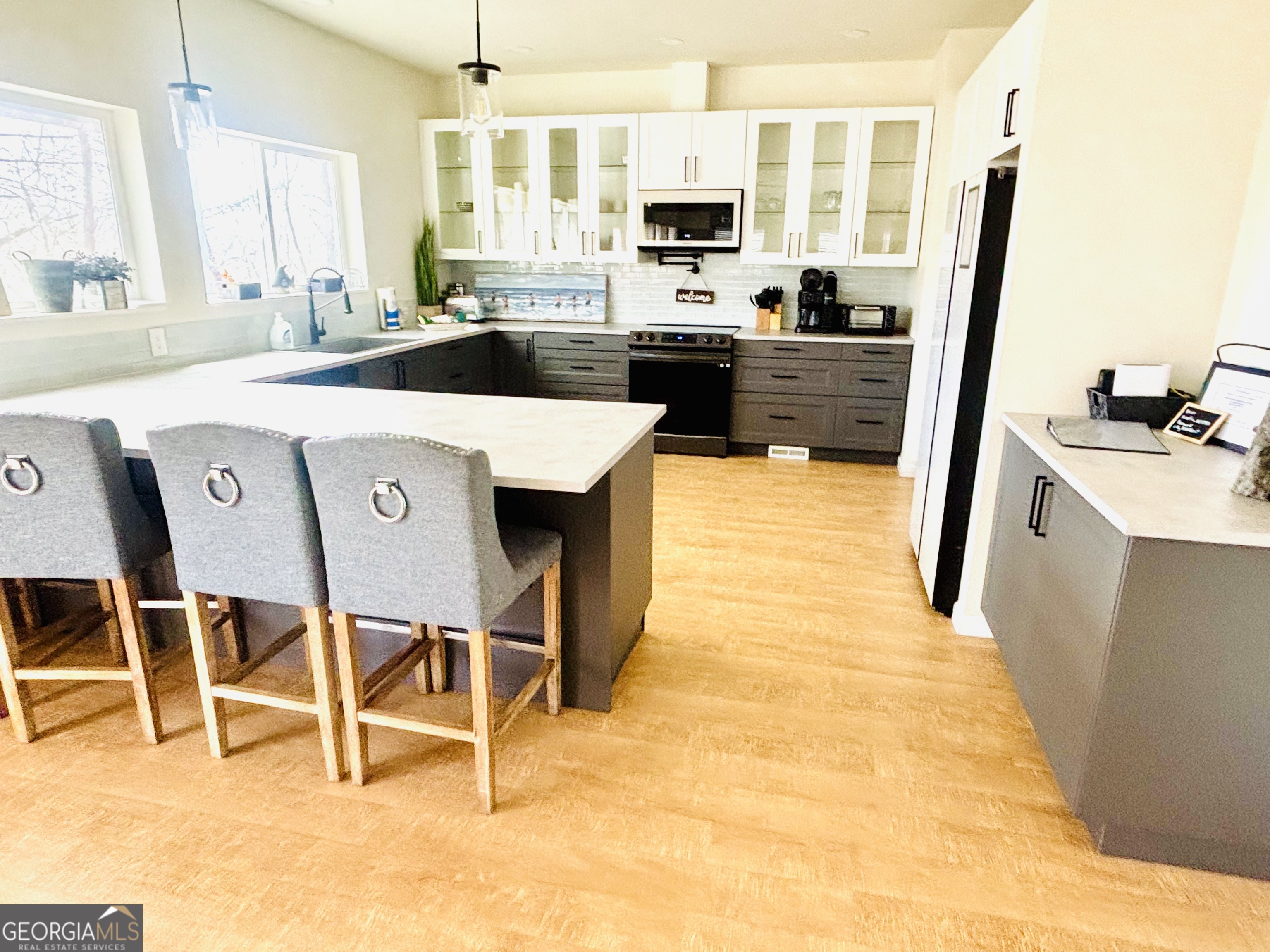 364 Rosen Strasse Helen, GA 30545 - Photo 8 of 45 a kitchen with kitchen island granite countertop a sink appliances and cabinets