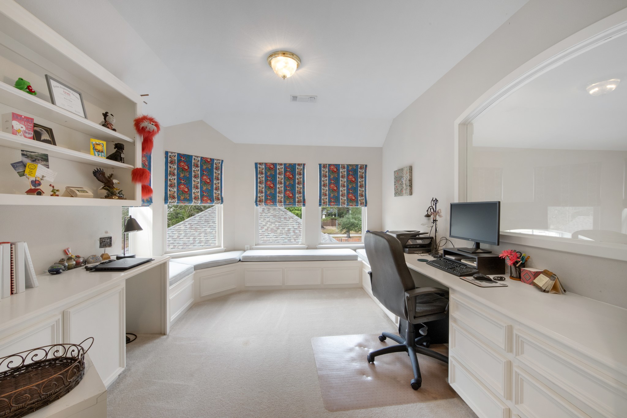 9510 Ashdown Forest Drive Spring, TX 77379 - Photo 36 of 50 OFFICE – built-in desk and shelving create a perfect workspace for studying or working from home. Large windows and a built-in window seat add charm and natural light. Lots of storage here!