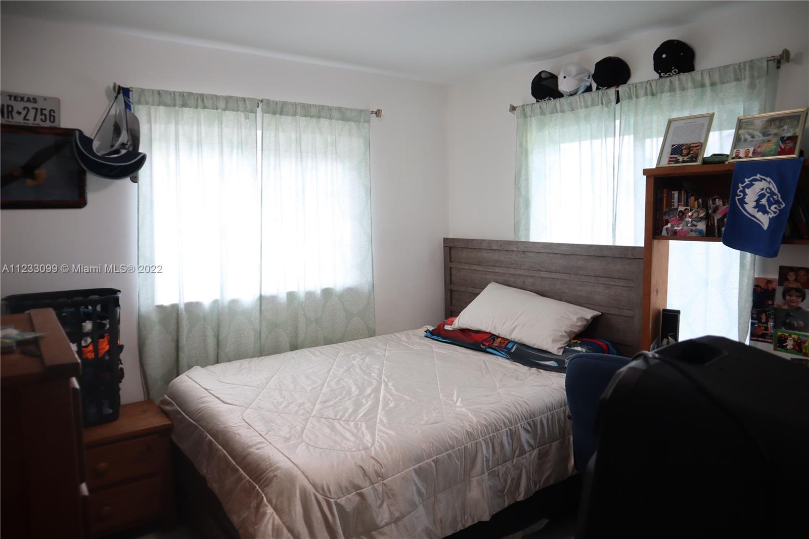 15261 Southwest 303rd Street Homestead, FL 33033 - Photo 12 of 23 a bedroom with a bed and a window
