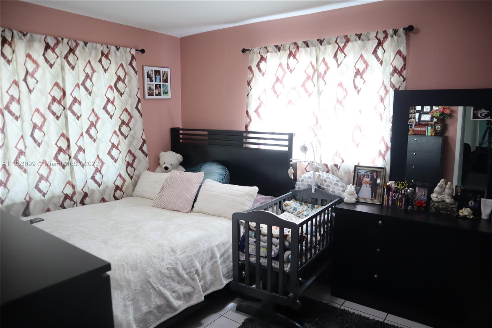 15261 Southwest 303rd Street Homestead, FL 33033 - Photo 13 of 23 a bedroom with a bed and a window