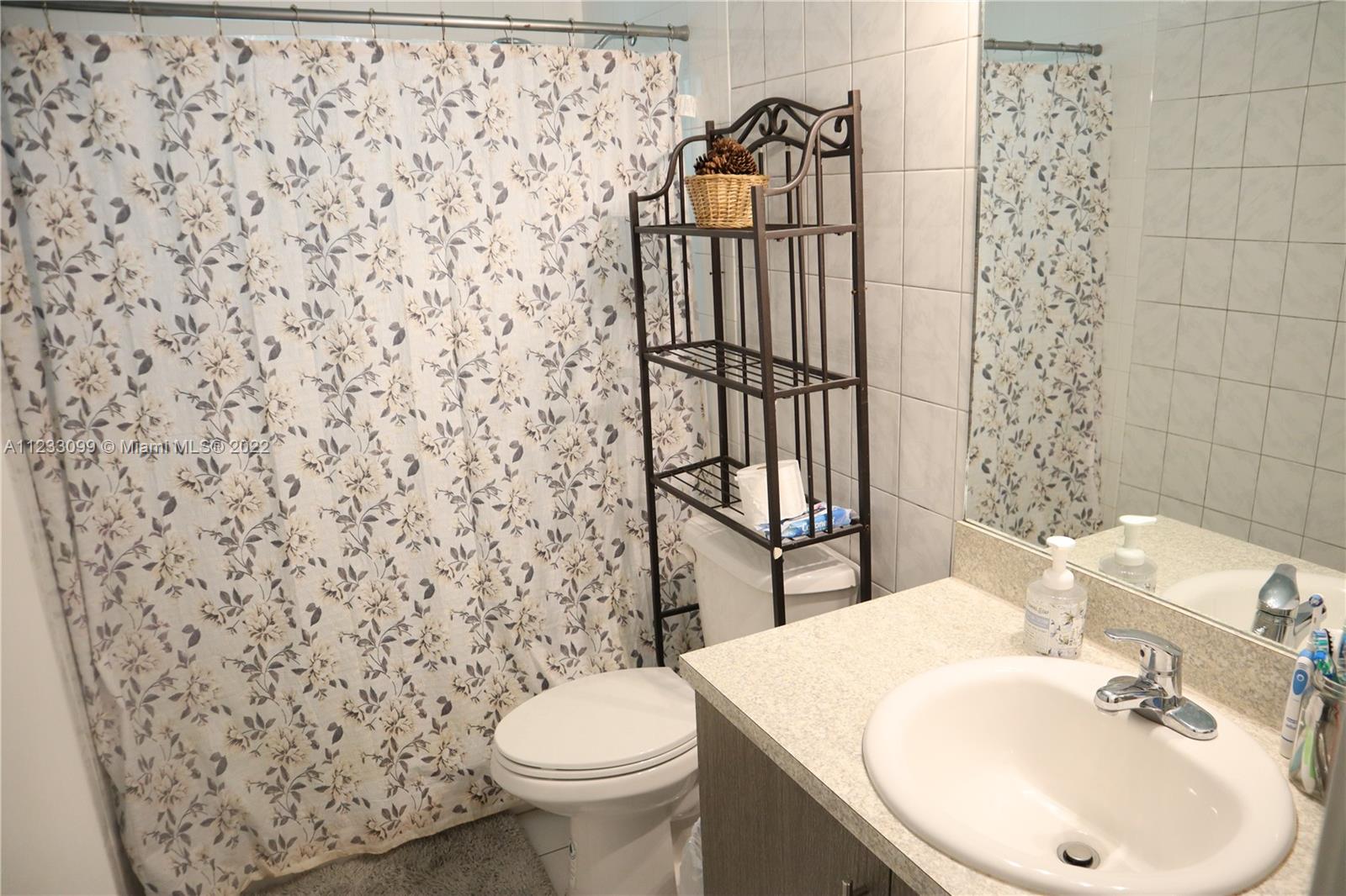 15261 Southwest 303rd Street Homestead, FL 33033 - Photo 14 of 23 a bathroom with a sink and a toilet