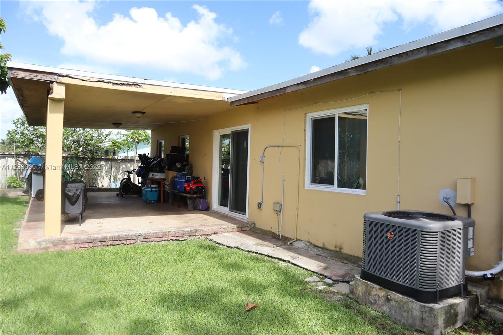 15261 Southwest 303rd Street Homestead, FL 33033 - Photo 17 of 23 a living room with furniture