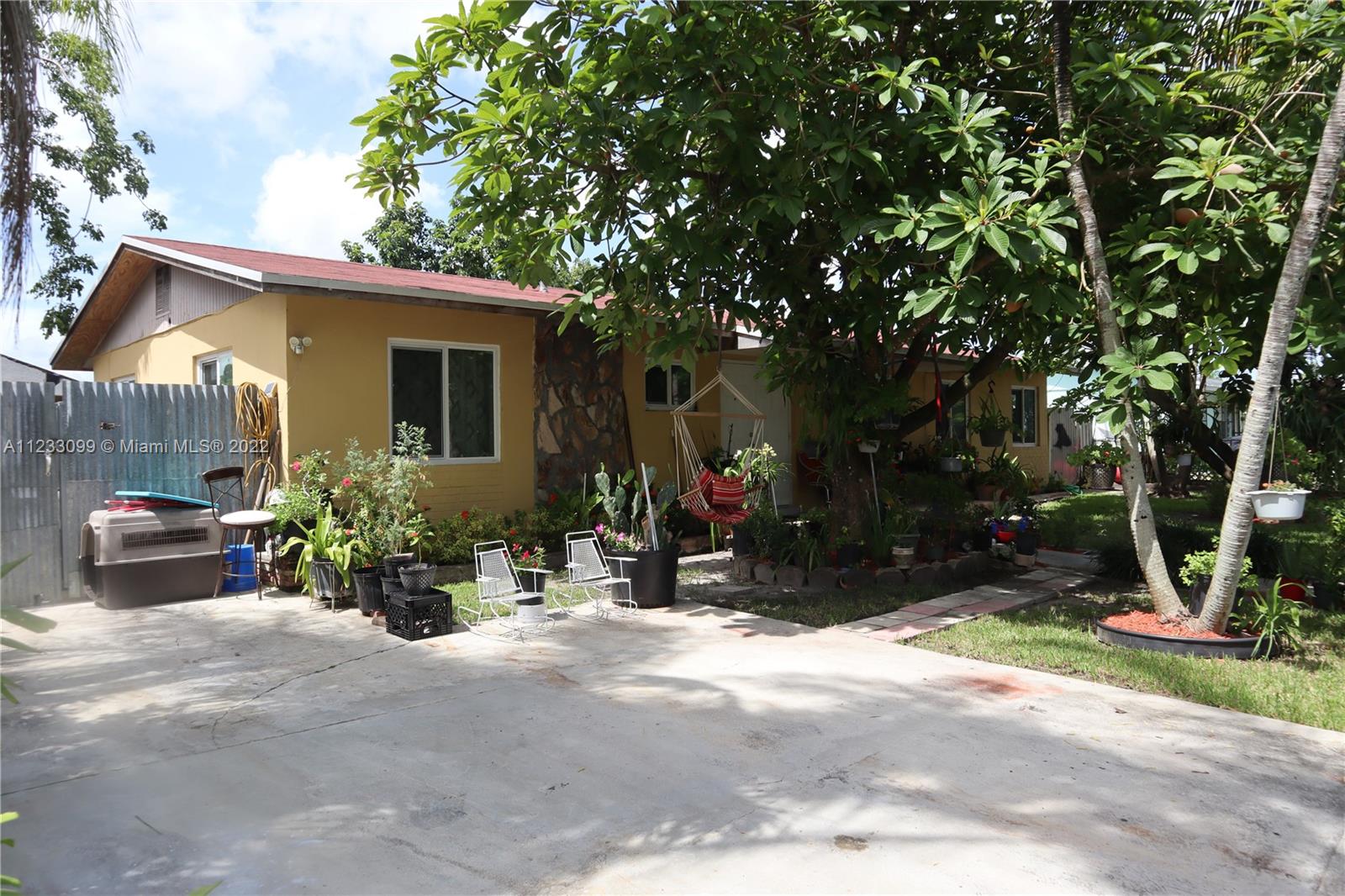 15261 Southwest 303rd Street Homestead, FL 33033 - Photo 2 of 23 a view of a house with backyard and garden