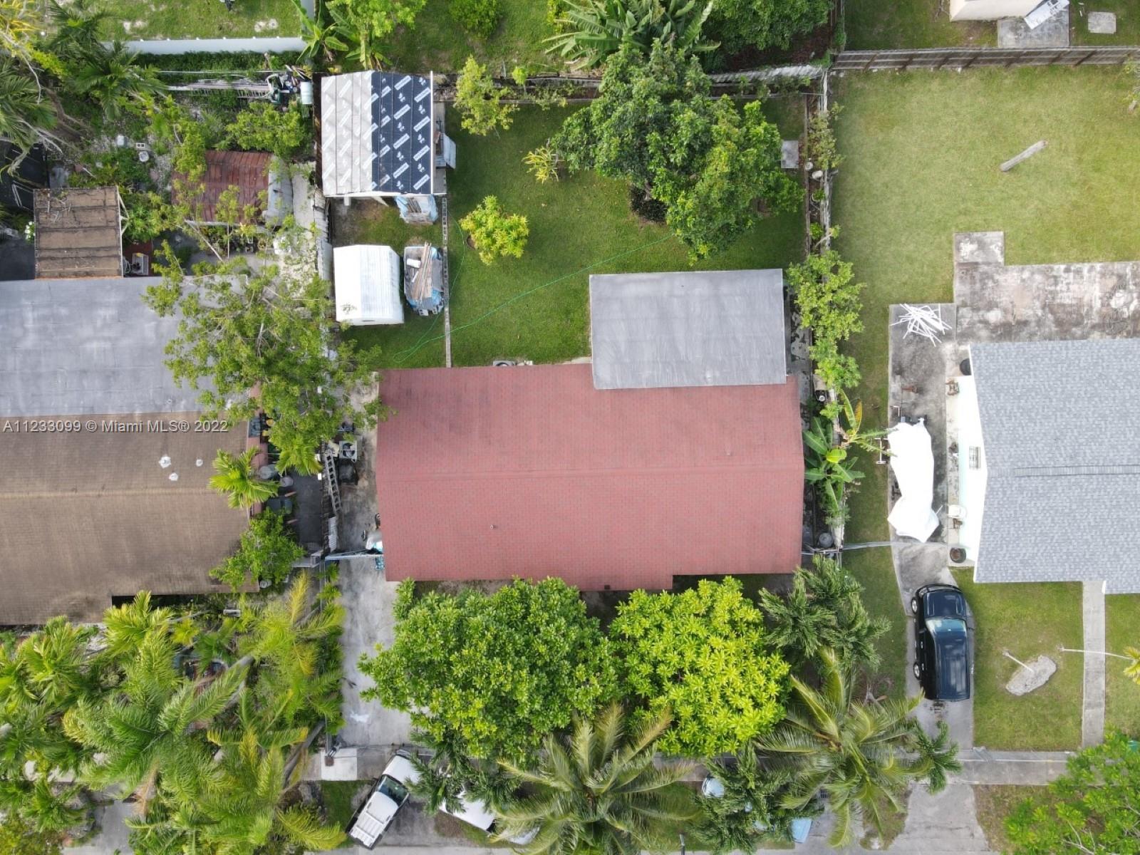15261 Southwest 303rd Street Homestead, FL 33033 - Photo 22 of 23 an aerial view of a house with a garden and plants