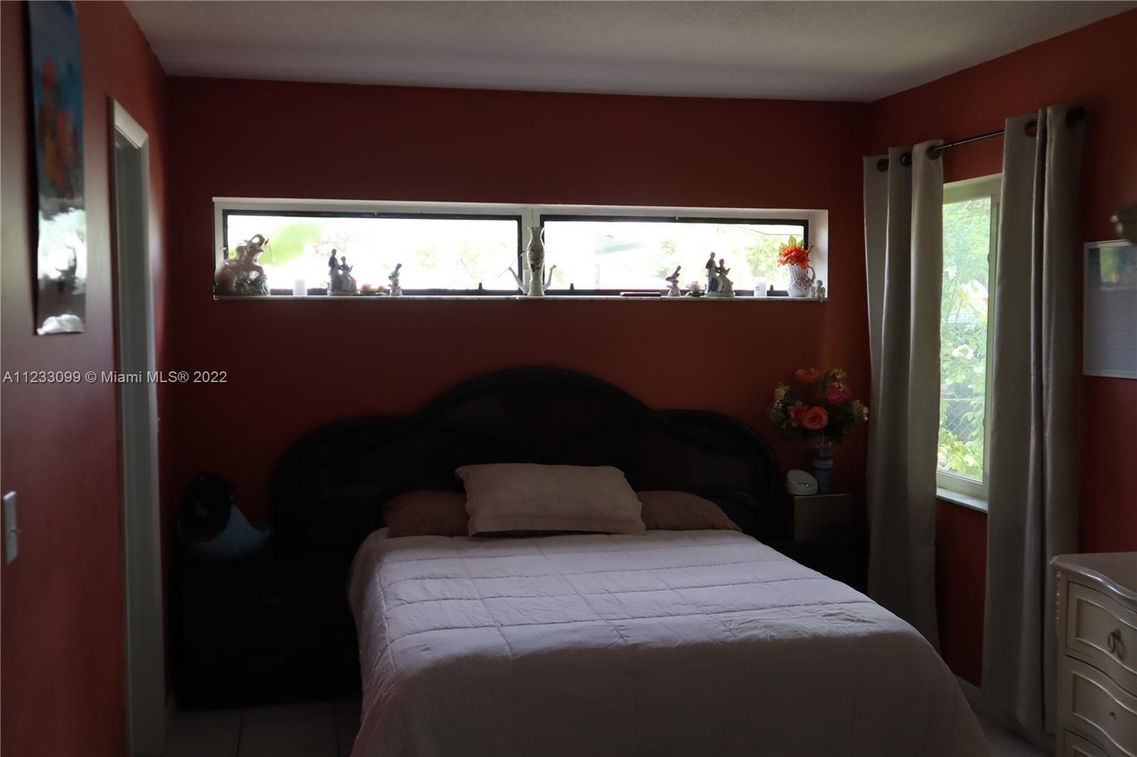 15261 Southwest 303rd Street Homestead, FL 33033 - Photo 9 of 23 a bedroom with a bed and window
