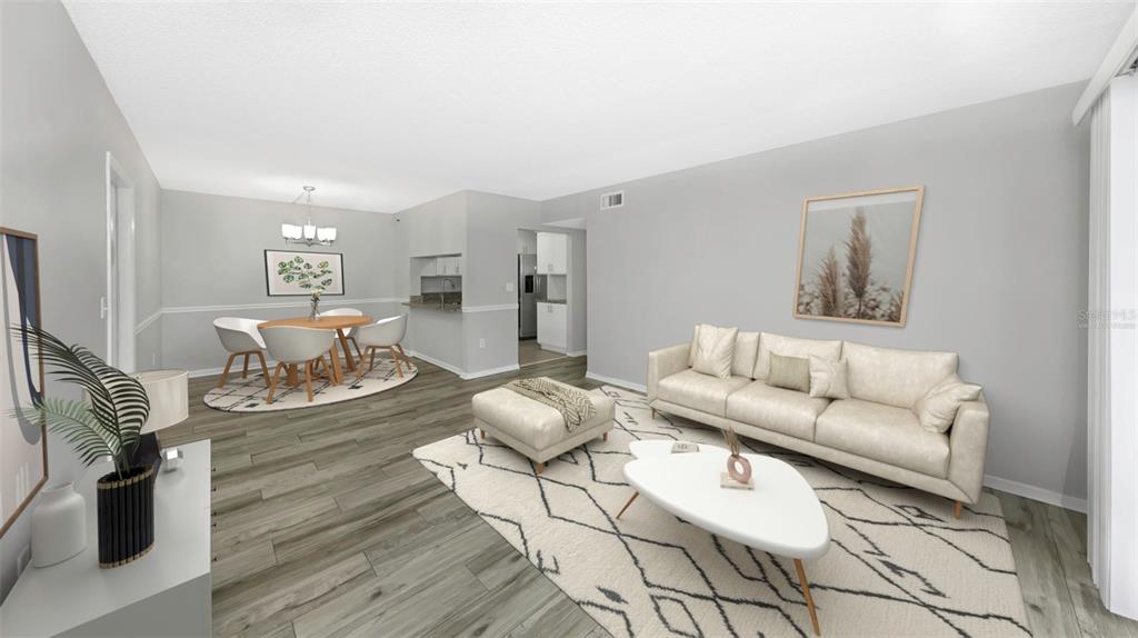 1308 Pine Ridge Circle East, Unit H1 Tarpon Springs, FL 34688 - Photo 2 of 50 a living room with furniture and wooden floor