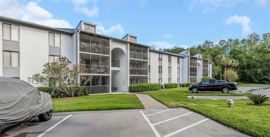 1308 Pine Ridge Circle East, Unit H1 Tarpon Springs, FL 34688 - Photo 36 of 50 a view of a house with a yard