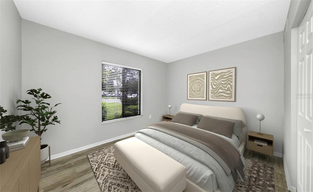 1308 Pine Ridge Circle East, Unit H1 Tarpon Springs, FL 34688 - Photo 4 of 50 a bedroom with a bed and a window