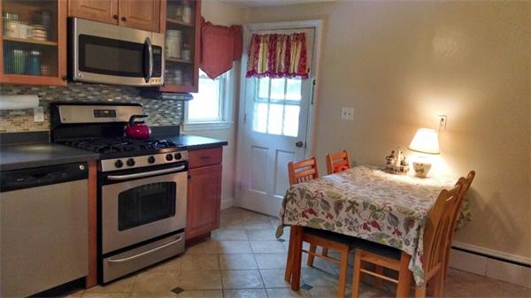 69 Ardmore Road Framingham, MA 01702 - Photo 11 of 30 a kitchen that has a stove and a microwave
