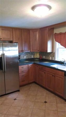 69 Ardmore Road Framingham, MA 01702 - Photo 14 of 30 a kitchen with granite countertop a cabinets and steel stainless steel appliances with cabinets