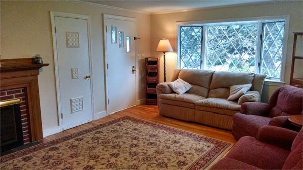 69 Ardmore Road Framingham, MA 01702 - Photo 6 of 30 a living room with furniture and a fireplace
