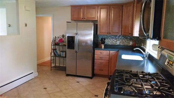 69 Ardmore Road Framingham, MA 01702 - Photo 10 of 30 a kitchen with stainless steel appliances granite countertop a refrigerator and a stove