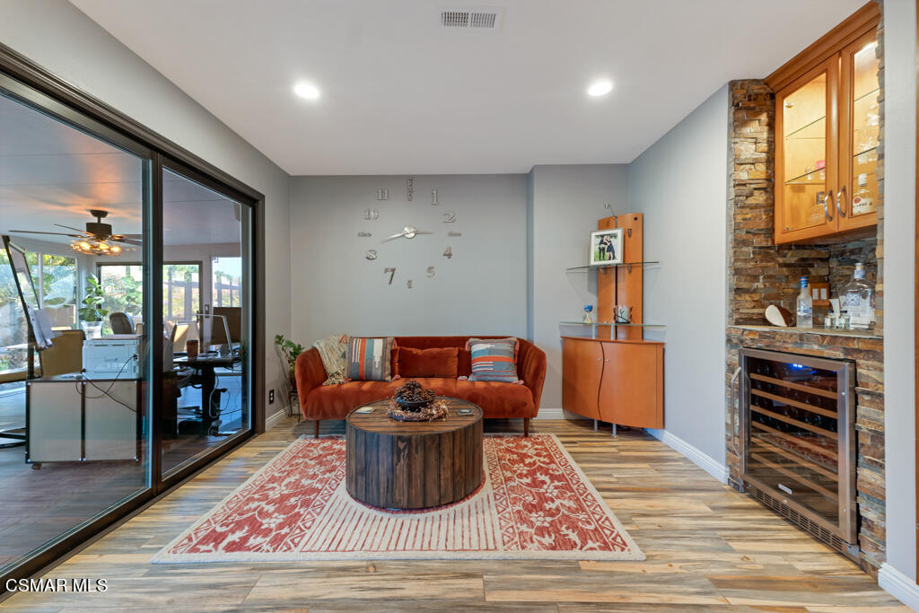 24 Kanan Road Oak Park, CA 91377 - Photo 11 of 20 a living room with furniture windows and wooden floor