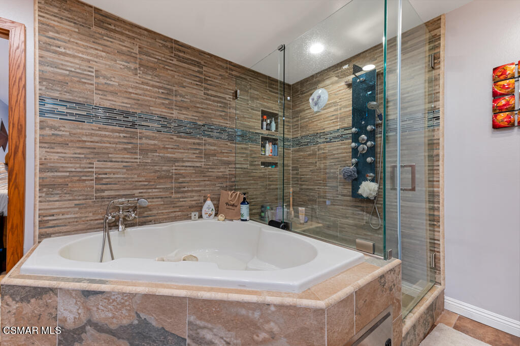 24 Kanan Road Oak Park, CA 91377 - Photo 17 of 20 a bathroom with a bathtub and shower