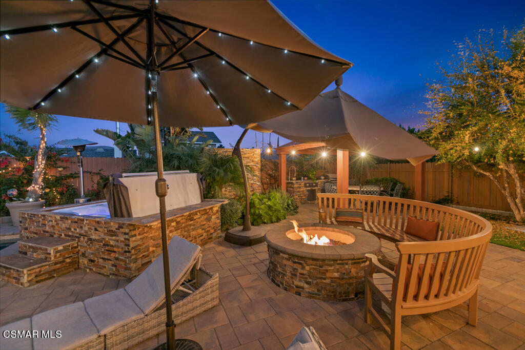24 Kanan Road Oak Park, CA 91377 - Photo 18 of 20 a view of a patio with a table and chairs under an umbrella