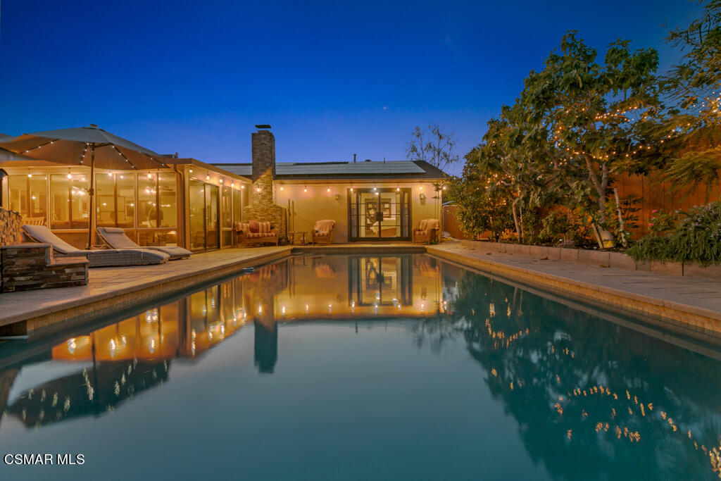 24 Kanan Road Oak Park, CA 91377 - Photo 19 of 20 a view of a swimming pool with a lounge chair