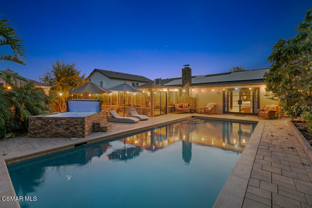 24 Kanan Road Oak Park, CA 91377 - Photo 2 of 20 a view of a swimming pool with a chairs