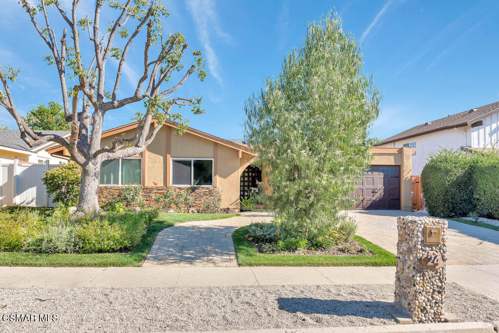 24 Kanan Road Oak Park, CA 91377 - Photo 3 of 20 front view of a house with a yard