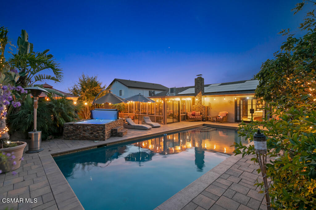 24 Kanan Road Oak Park, CA 91377 - Photo 4 of 20 a view of a swimming pool with an outdoor seating