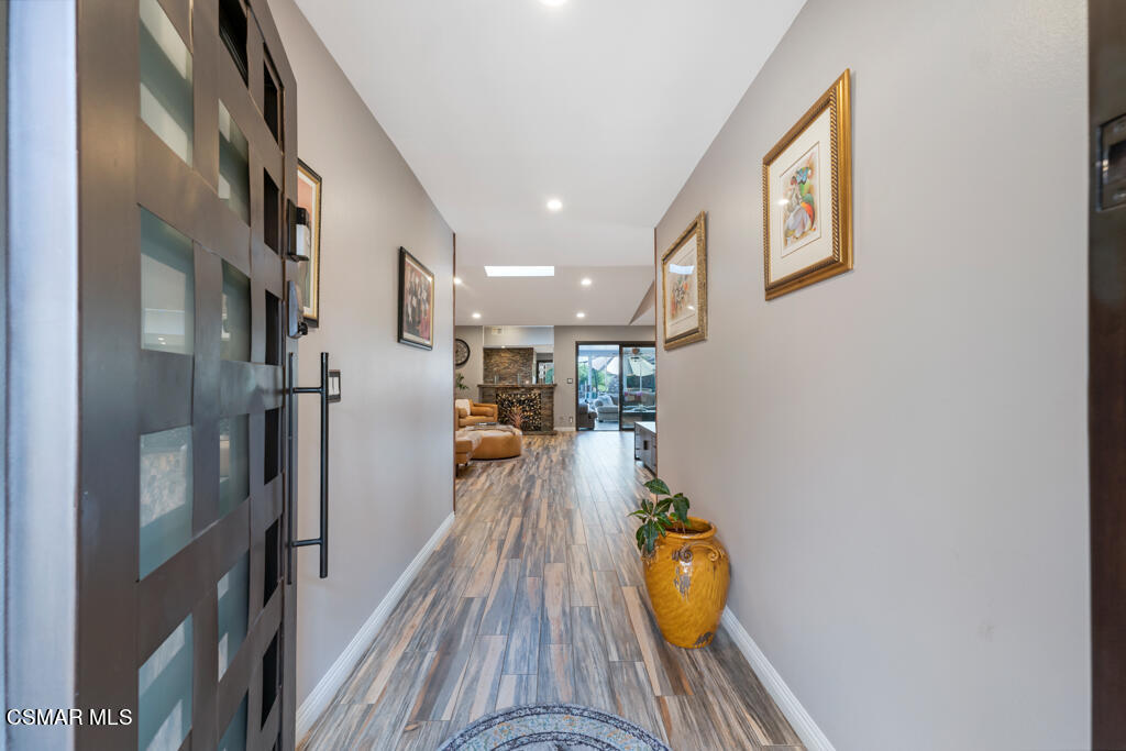 24 Kanan Road Oak Park, CA 91377 - Photo 6 of 20 a view of a hallway view with wooden floor and staircase