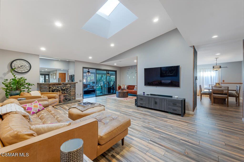 24 Kanan Road Oak Park, CA 91377 - Photo 7 of 20 a living room with furniture and a flat screen tv
