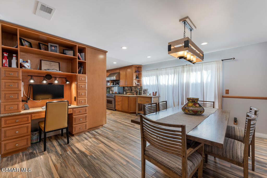 24 Kanan Road Oak Park, CA 91377 - Photo 8 of 20 a view of a dining room with furniture and wooden floor