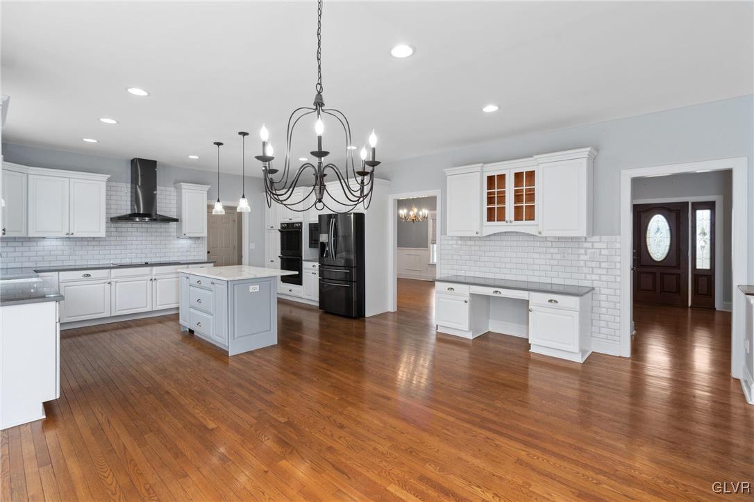 153 Doney Road Kunkletown, PA 18058 - Photo 23 of 46 a large kitchen with sink cabinets and wooden floor