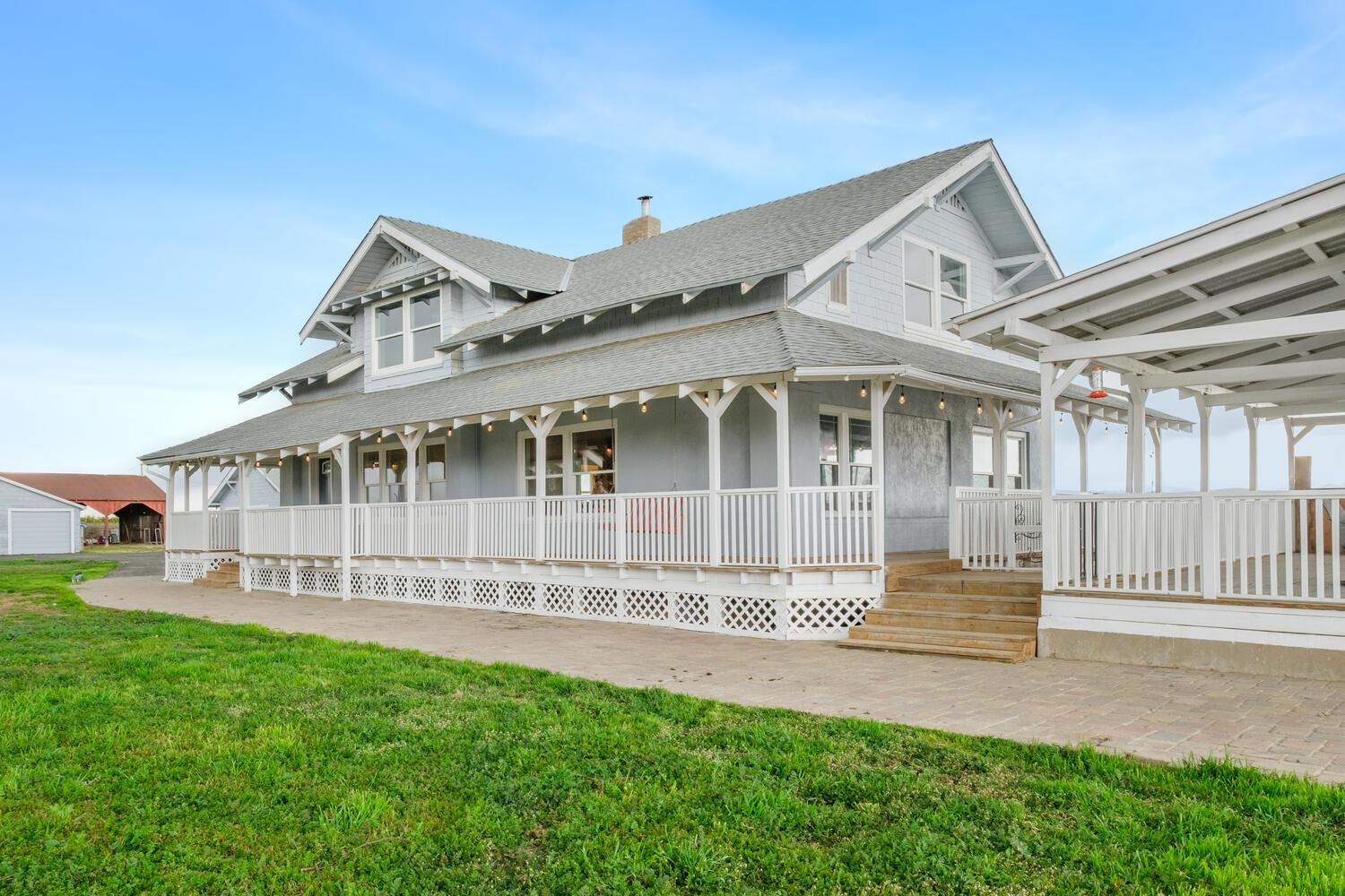 a view of a house with a yard and a garden