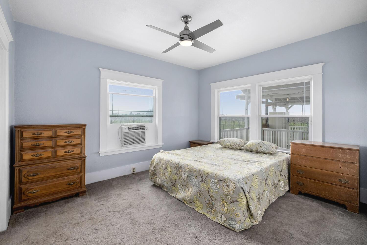 5804 Ave 426 Reedley, CA 93654 - Photo 12 of 21 a bedroom with a bed a dresser and a window