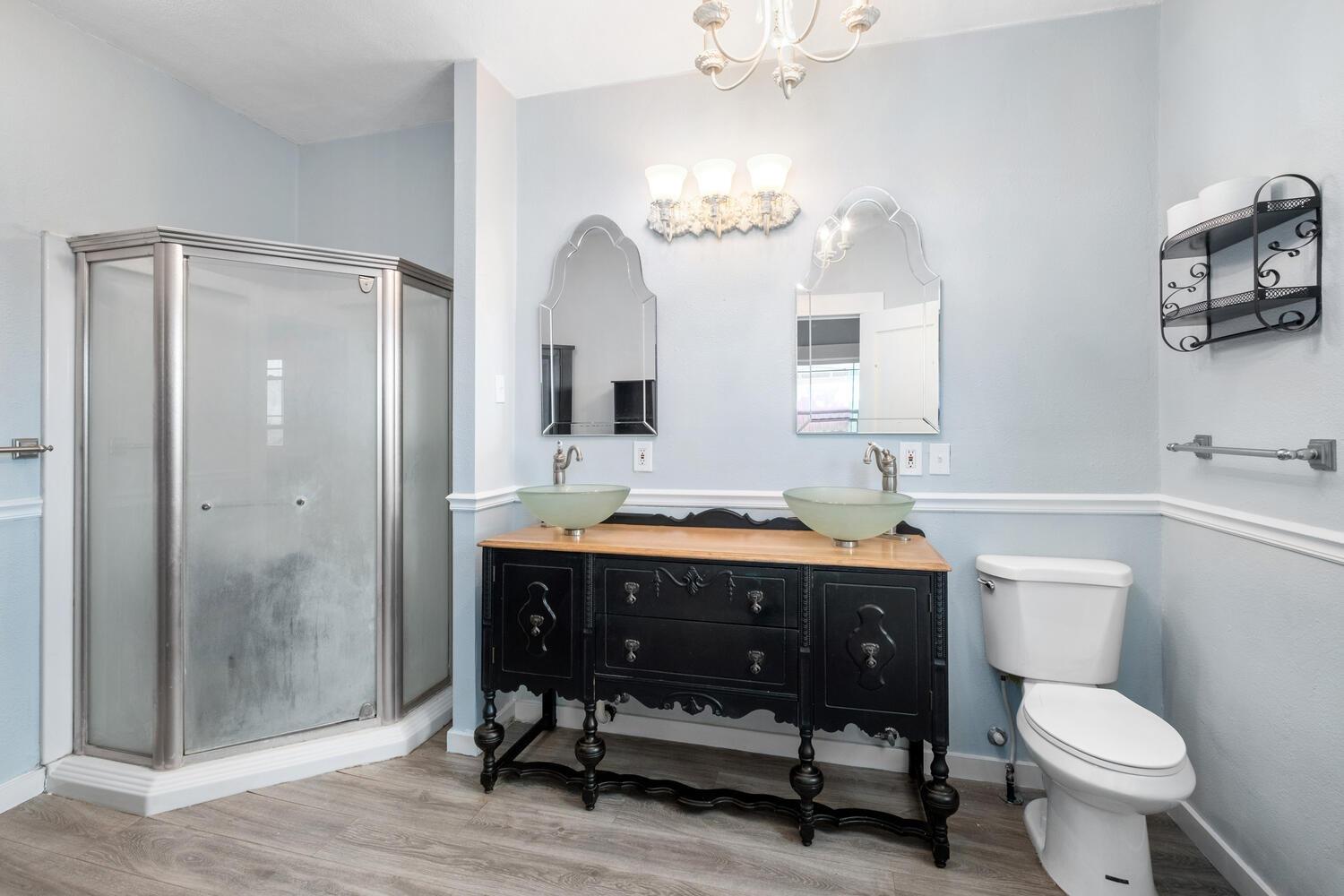 5804 Ave 426 Reedley, CA 93654 - Photo 13 of 21 a bathroom with a sink a toilet and a mirror