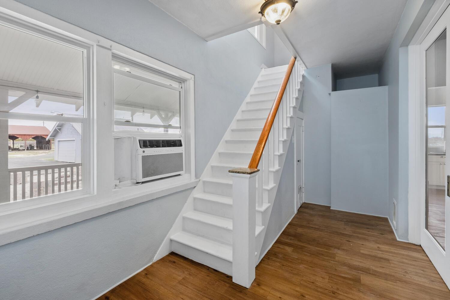 5804 Ave 426 Reedley, CA 93654 - Photo 14 of 21 a view of entryway and hall with wooden floor