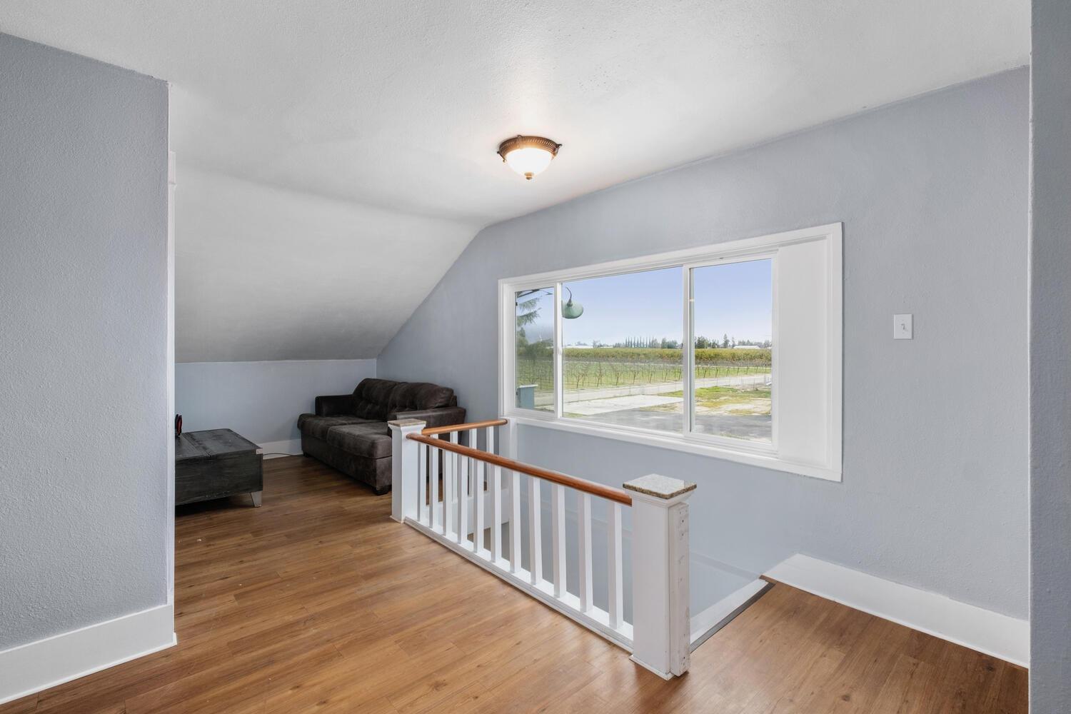 5804 Ave 426 Reedley, CA 93654 - Photo 15 of 21 a view of a room with wooden floor and a window