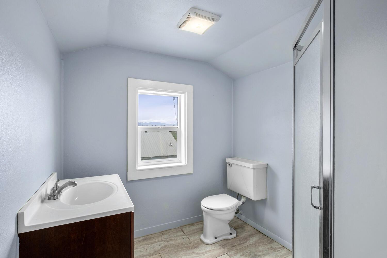 5804 Ave 426 Reedley, CA 93654 - Photo 17 of 21 a bathroom with a sink toilet and vanity