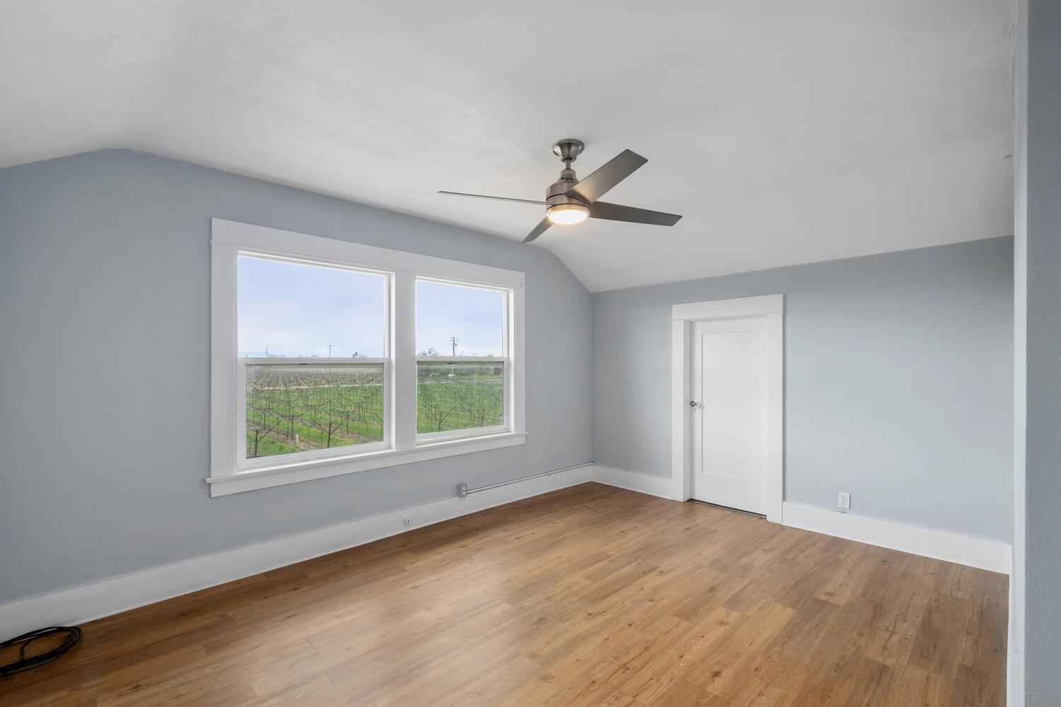 5804 Ave 426 Reedley, CA 93654 - Photo 18 of 21 wooden floor in an empty room with a window