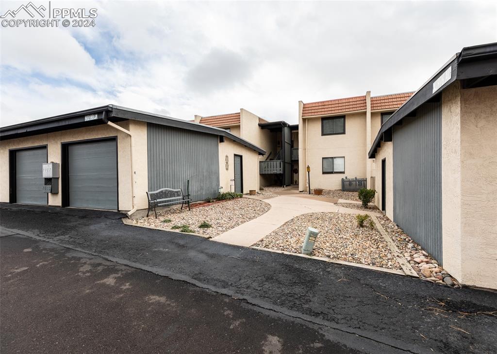 922 Fontmore Road, Unit D Colorado Springs, CO 80904 - Photo 39 of 44 a white house with a outdoor space