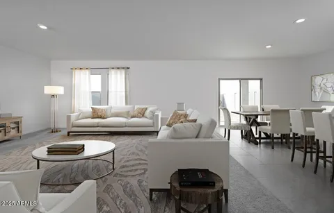 a living room with furniture and a table